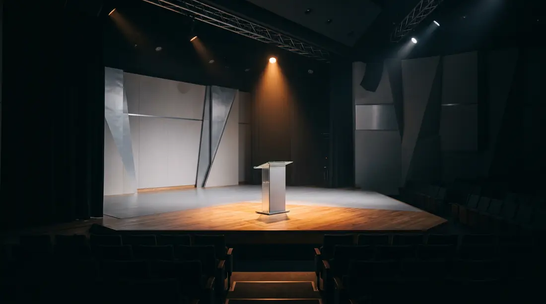 Empty lecture stage and podium prepared for a training session