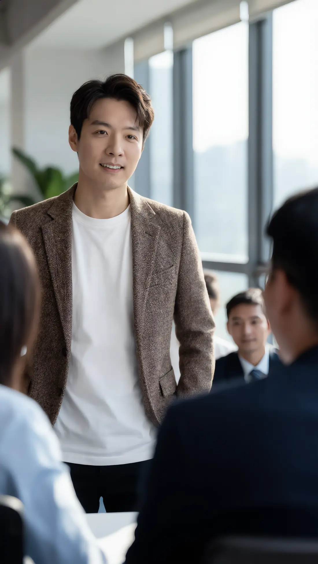 Andrew Tan teaching a small group in an office setting